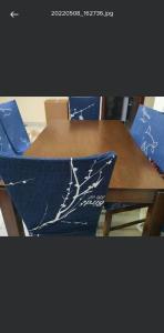 Dining table with six chairs in excellent new condition .