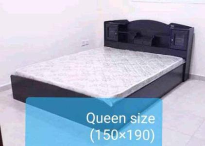 We are selling Brand New wood Bed