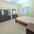 Furnished room with attached bathroom