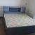 We are selling Brand New wood Bed