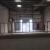 Warehouse with Small Mezzanine For Rent In Dubai Investment Park and Eaves Height 8M